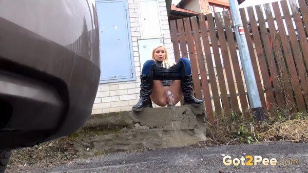 Blonde babe pisses onto concrete like a sprinkler (1080p)